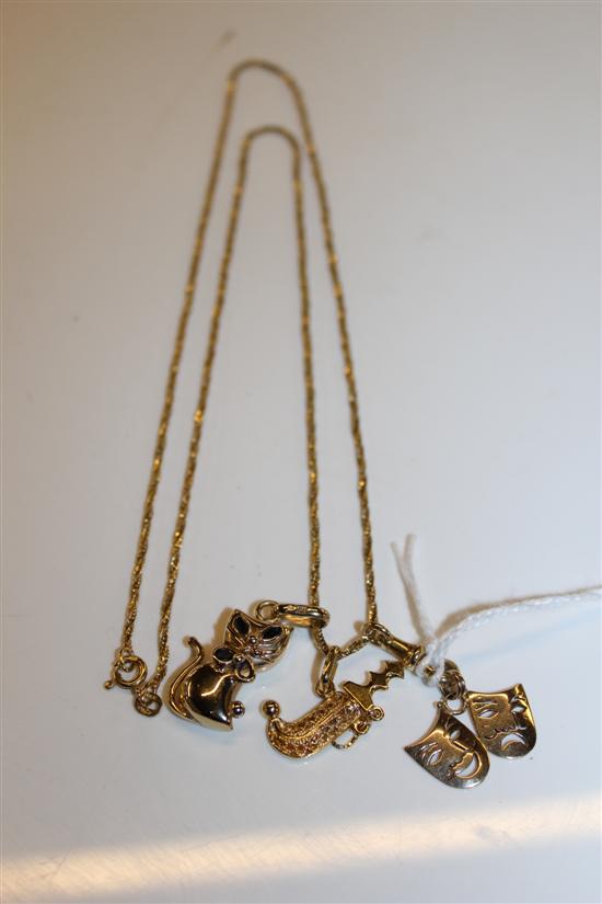 18ct gold chain with 18ct gold dagger charm & 2 9ct gold charms